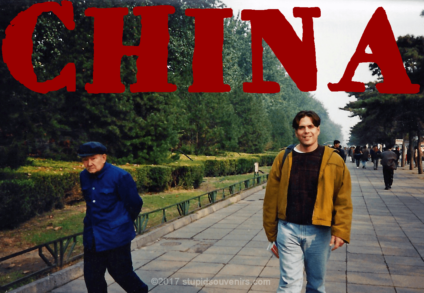 American tourist walking with Chinese man in Beijing.