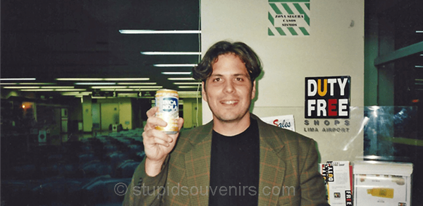 Tourist with an inca kola in Lima Peru.